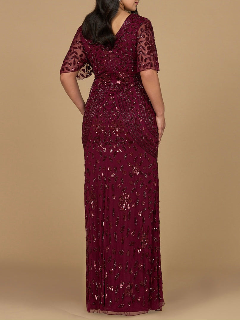 Robe longue perlée à col en V et manches cape