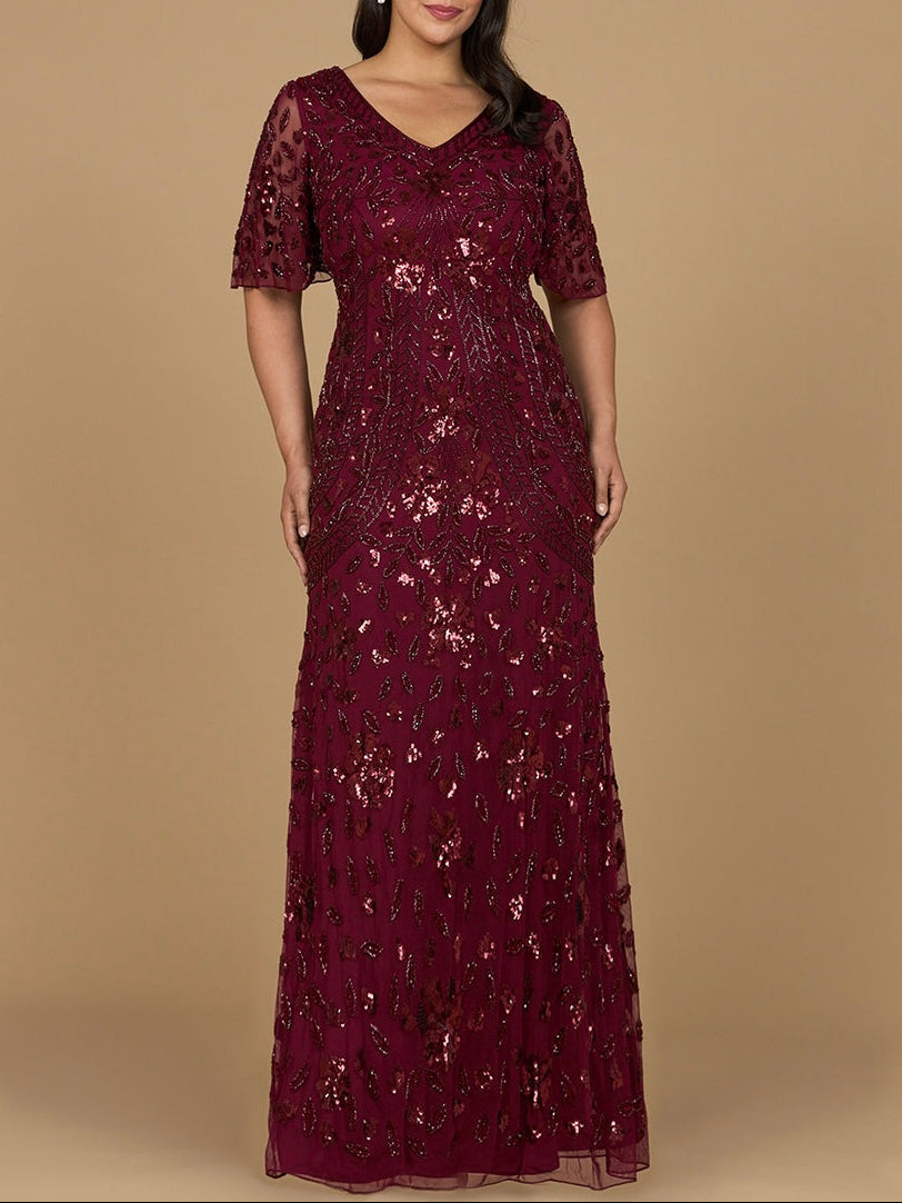 Robe longue perlée à col en V et manches cape