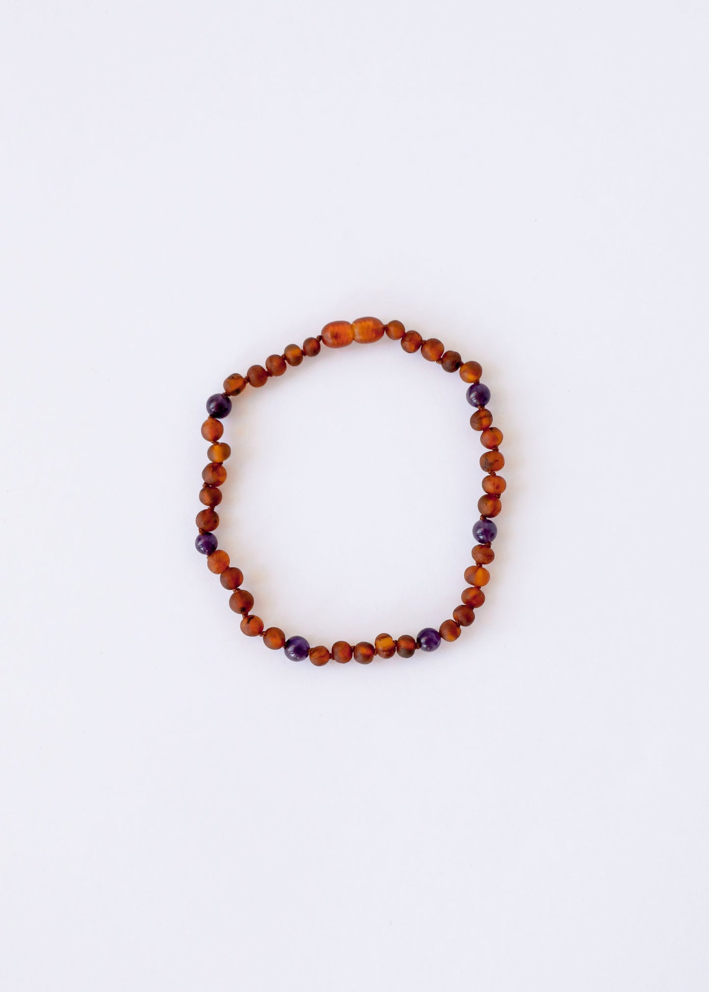 Collier halo en ambre baltique brut de Cognac et améthyste