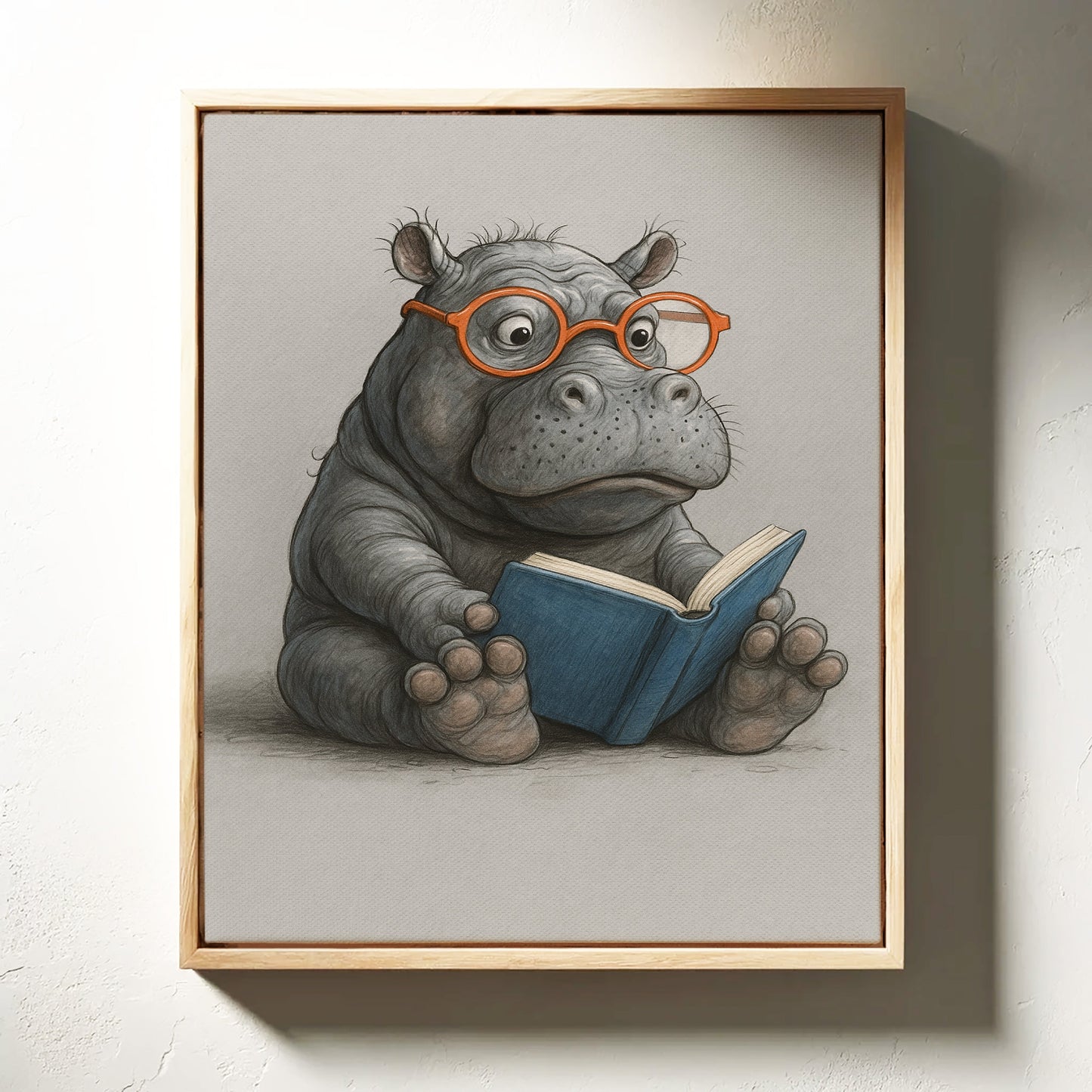 Baby-Nilpferd liest mit Brille