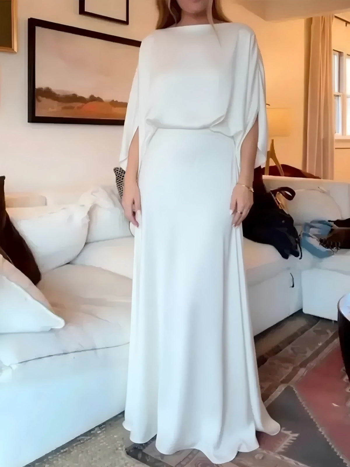 A Sleek Solid-color Satin Dress With Smooth Lines
