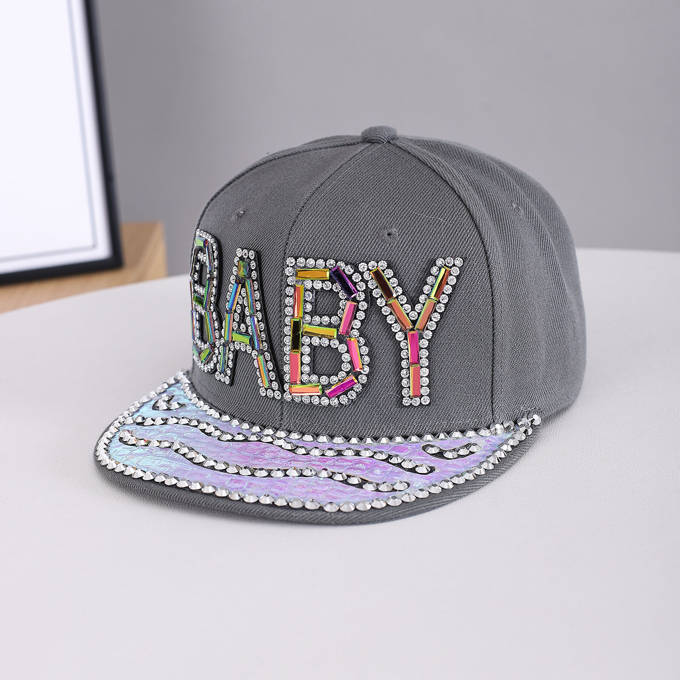 Men's And Women's Identical Colorful Diamond BABY Letter Hot Stamping Diamond Brim Hat. This Stylish Hip-hop Style Flat Brim Hat Is Suitable For Personalized Streetwear Outfits.
