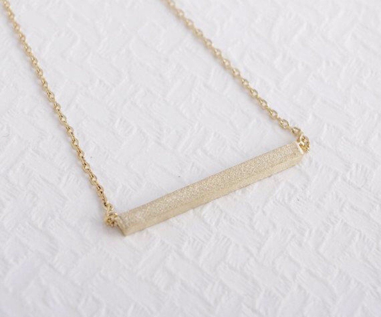 Collier pendentif barre Latitude
