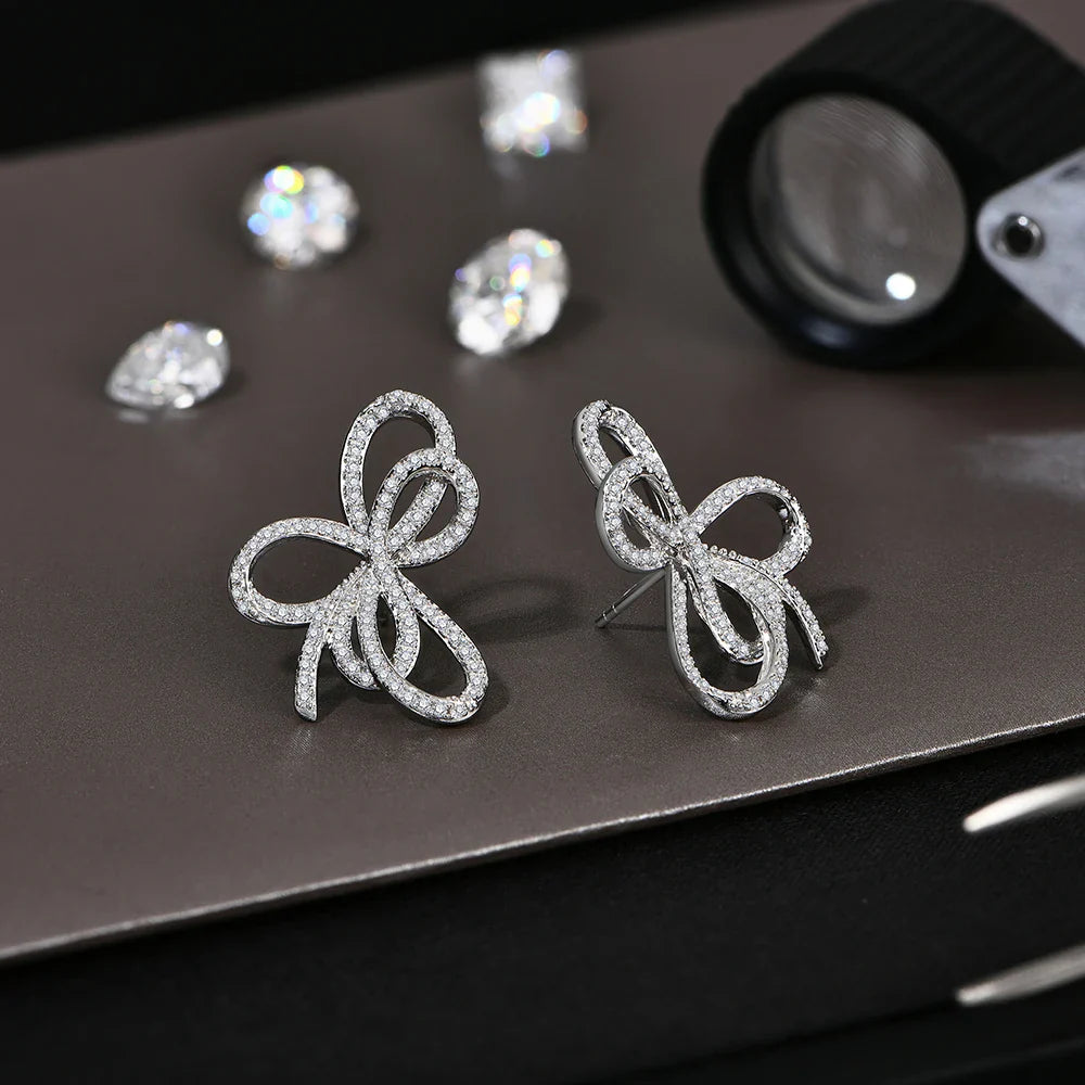 Boucles d'oreilles clous en moissanite avec nœud papillon en argent sterling 925 étincelant pour fiançailles