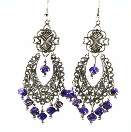 Boucles d'oreilles pendantes fantaisie en métal argenté et volutes bohème bleues